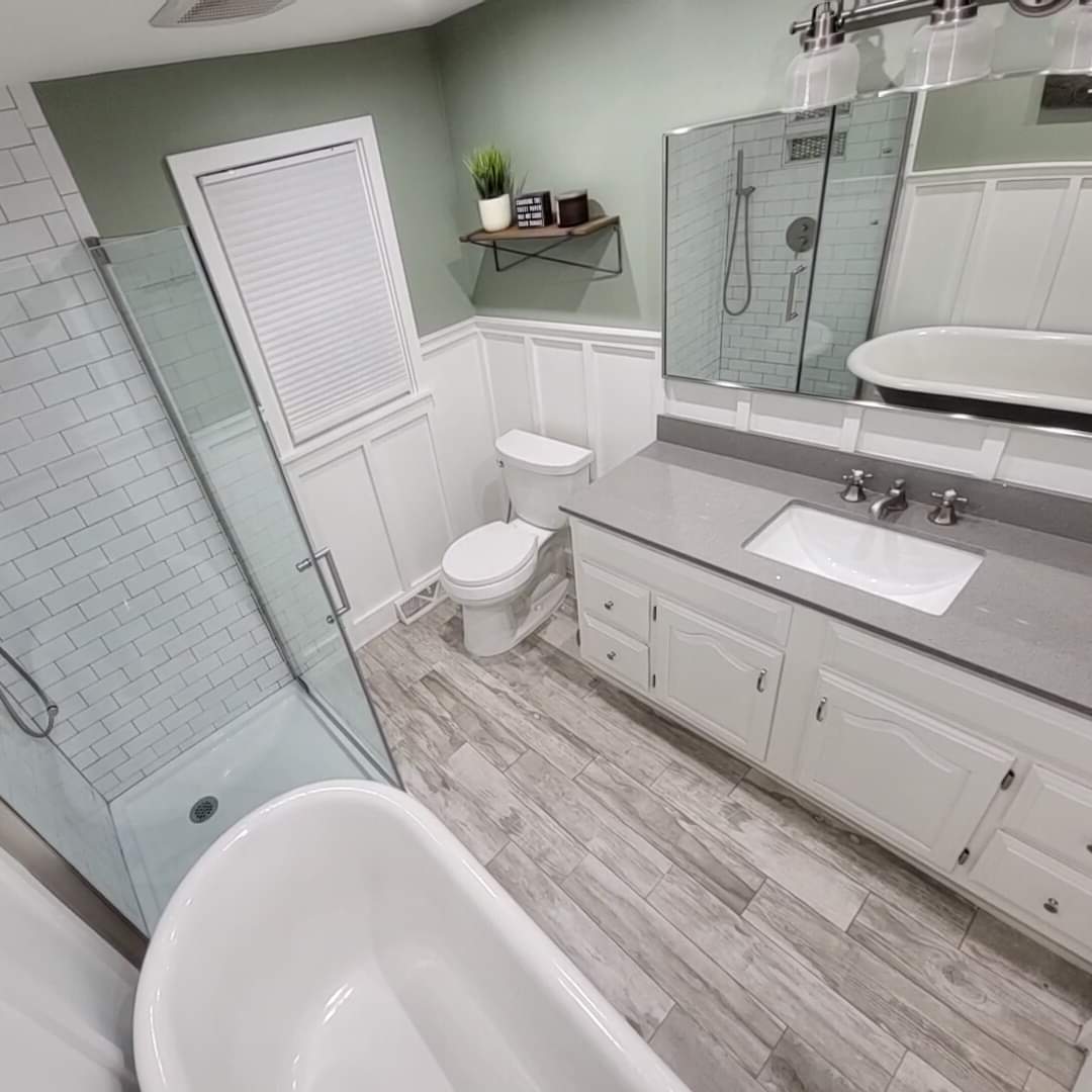 Bathroom Remodel with glass shower enclosure and clawfoot tub