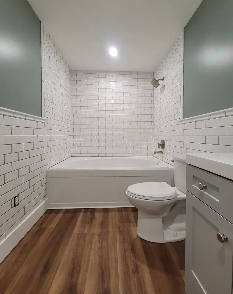 bathroom remodel with subway tile wainscot